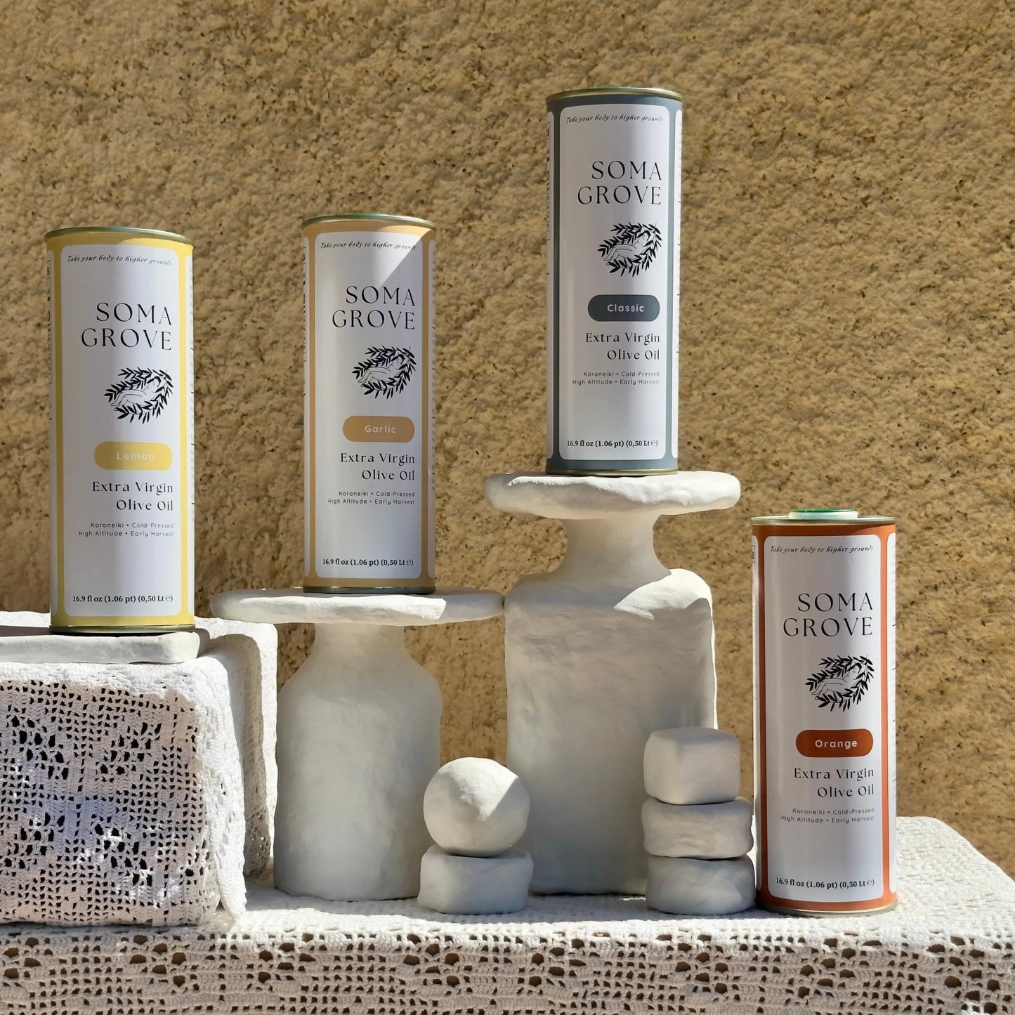 The complete Soma Grove olive oil set, featuring Classic, Garlic, Lemon, & Orange for ultimate recipe and flavor versatility.