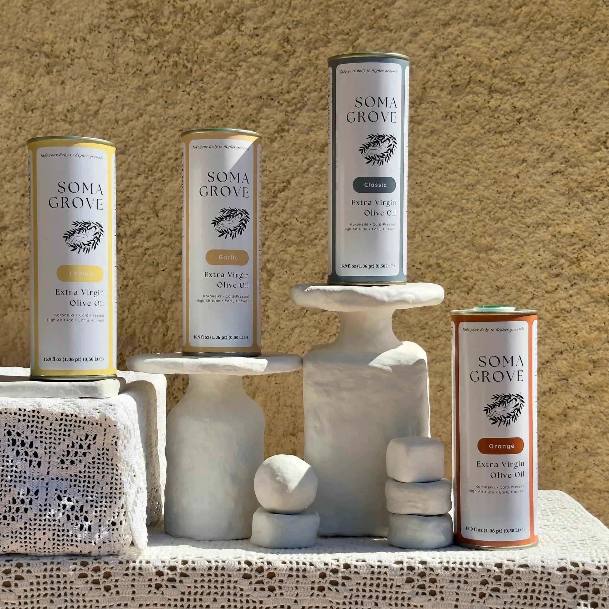The complete Soma Grove olive oil set, featuring Classic, Garlic, Lemon, & Orange for ultimate recipe and flavor versatility.