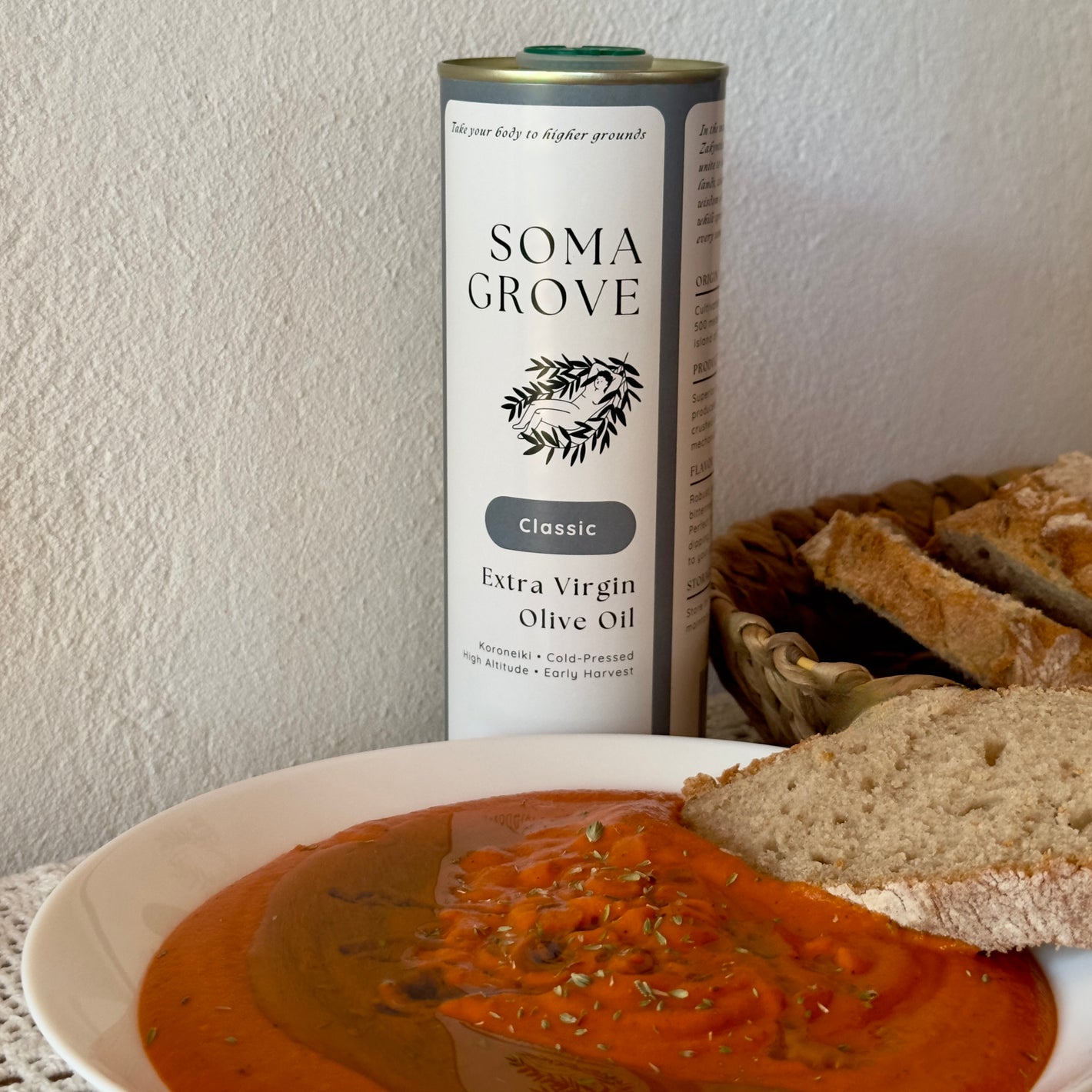 Red Pepper Chickpea Spread served with sourdough bread and Classic Extra Virgin Olive Oil by Soma Grove.